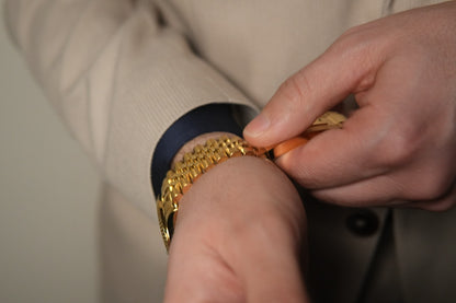 Man adjusting his stainless steel Valenne left-handed watch on his left wrist, emphasizing ergonomic comfort.