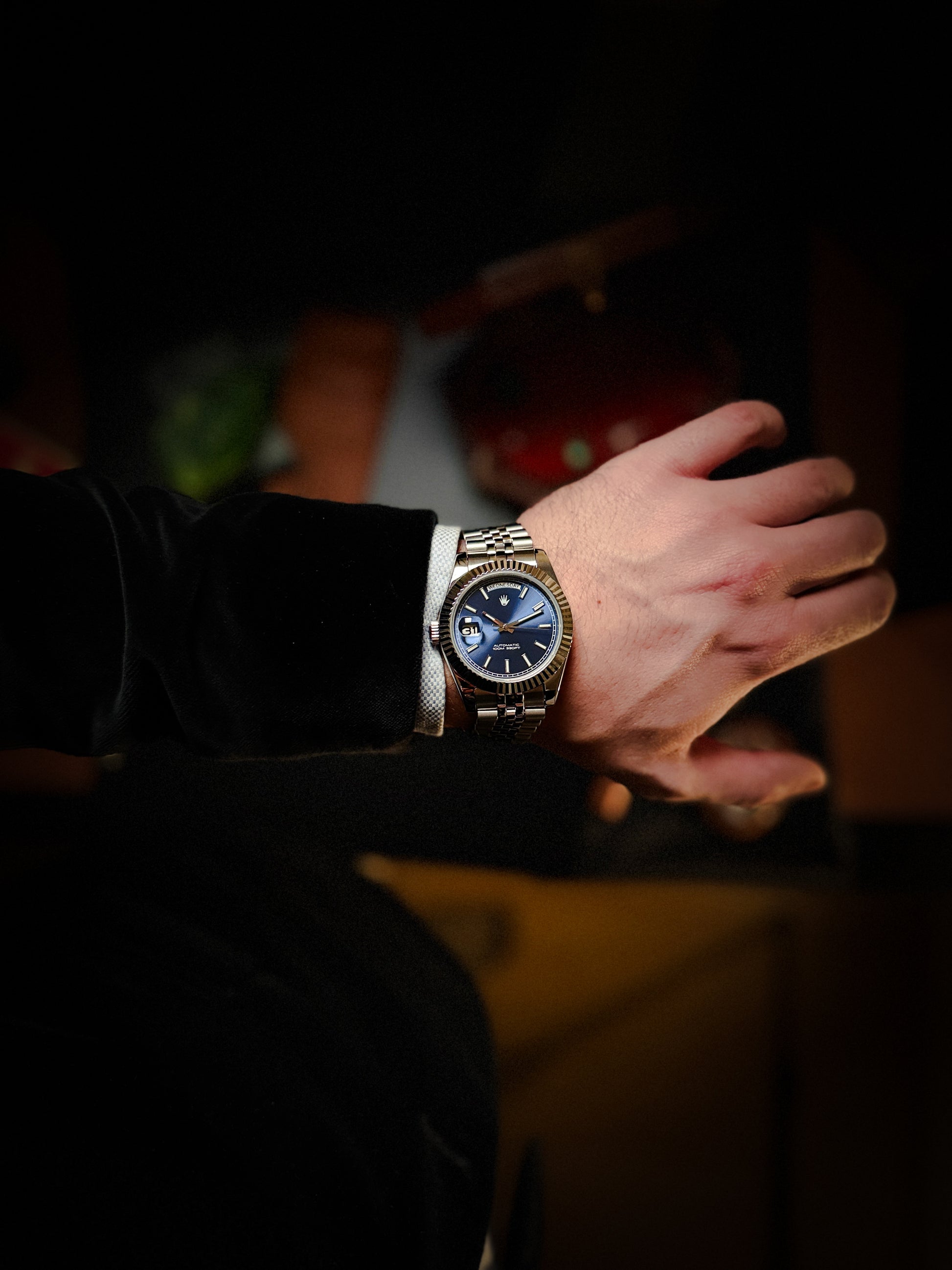 Lifestyle shot of the Valenne Destro steel watch worn comfortably on the wrist, showing the 9 o'clock crown.