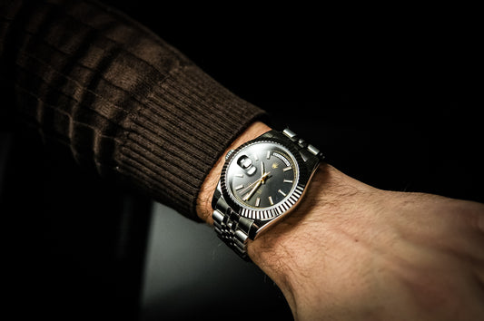 Professional studio shot of the Valenne destro watch in stainless steel featuring a black sunburst dial.